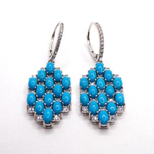 Sterling Silver Sleeping Beauty Turquoise Earrings: Zircon Accents