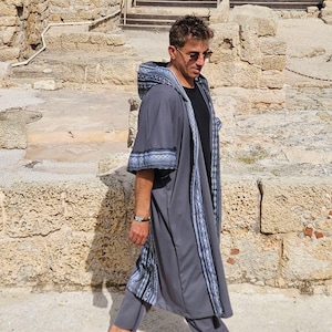 May include: A rustic wooden sign with the text "Welcome to our home" in white lettering. The sign features a distressed finish and a simple, inviting design, perfect for entryway decor.