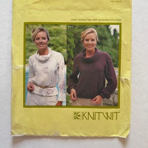 May include: A vintage sewing pattern for a cowl-necked top with extended shoulders. The pattern, labeled "pattern 1000," shows two variations of the top. The sizes range from 6 to 22. The brand logo "KNITWIT" is visible.