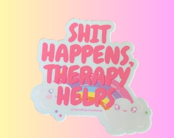 Op de afbeelding: Roze sticker met een regenboog en wolken. De sticker zegt "Shit Happens, Therapy Helps" met de tekst "@counselingcatherine" eronder.