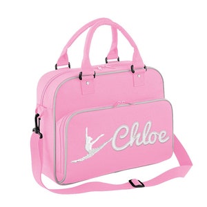 May include: Pink dance bag with a silver glitter ballerina silhouette and the name "Chloe" in silver glitter lettering.