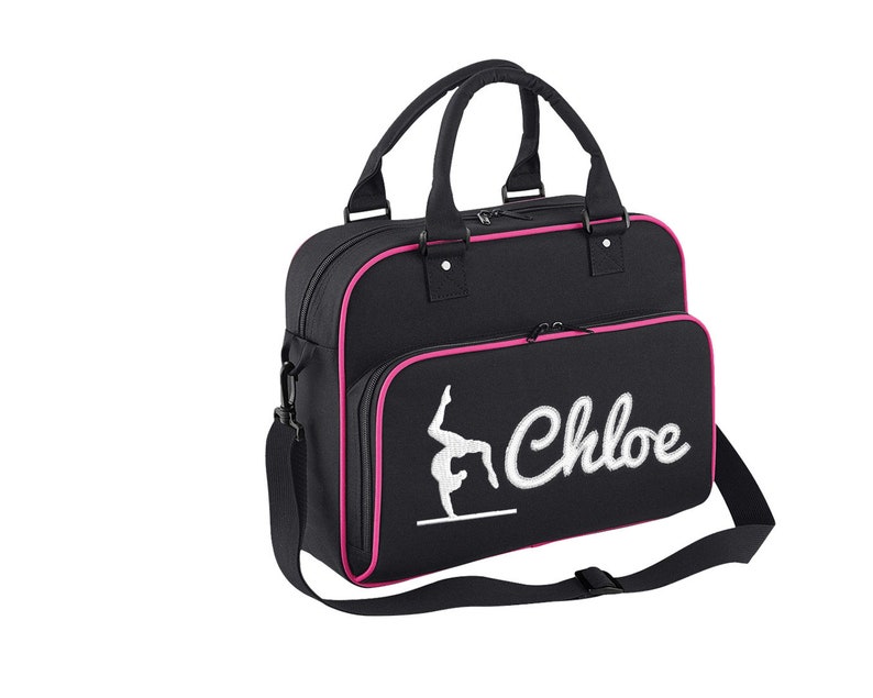 May include: Black gym bag with pink trim and a white embroidered gymnast silhouette and the name "Chloe".