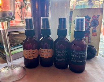 May include: Four brown glass spray bottles with labels that read "Botánica Copal y Mar Ochún", "Botánica Copal y Mar Yemaya", "Botánica Copal y Mar Limpieza", and "Botánica Copal y Mar Limpieza".