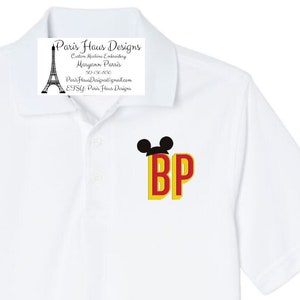 May include: White polo shirt with a red and yellow embroidered monogram "BP" with Mickey Mouse ears on top.