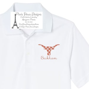 May include: White polo shirt with a red and white checkered Longhorn head and the name "Beckham" embroidered on the front. The shirt also has a small label with the text "Paris Haus Designs, Custom Machine Embroidery, Maryann Parris, 52-736-830, ParisHausDesigns@gmail.com, ETSY: Paris Haus Designs".