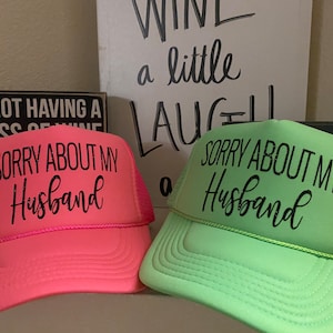 Neon green, trucker hat, sorry about my husband.