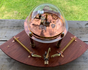 Steampunk kinetic sculpture with lights and crystals