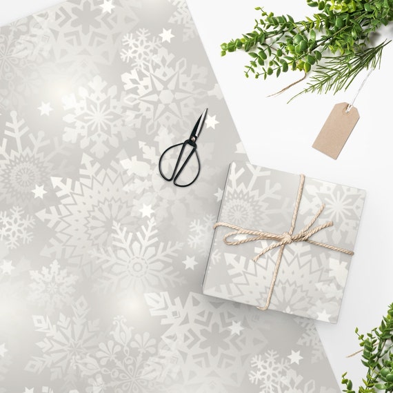 Winter gift wrap package snowflake print, bow, and personal note card