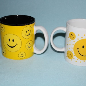 2) Happy Face (Smiley Face) Ceramic Mugs 1970&#39;s Betallic Inc. White One And burton+BURTON Yellow One Perfectly Giftable Condition