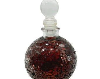 Frasco de perfume de vidrio con tapón transparente, mosaico rojo.