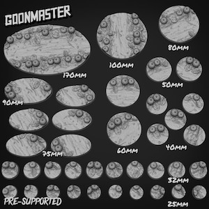 Puede incluir: Una colección de bases pre-soportadas para miniaturas, en tonos grises, con tamaños que varían de 25 mm a 170 mm. Cada base está decorada con un diseño floral y de hojas, ideal para juegos de mesa.