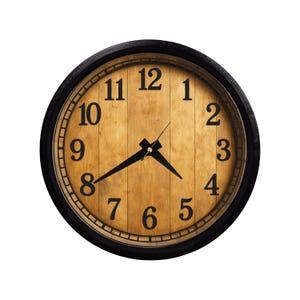 May include: Round wall clock with a black frame and a light brown wooden face. The clock features black numerals and hands, with the time displayed as approximately 7:50. The clock is isolated on a white background.