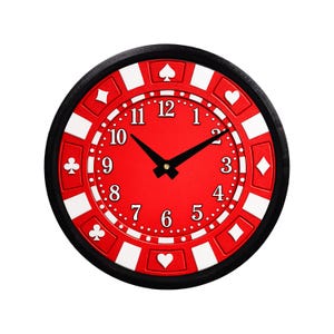May include: A round wall clock designed to resemble a red and white poker chip. The face features a solid red center with black Arabic numerals from 1 to 12, black hour and minute hands, and a border decorated with white card suit symbols.