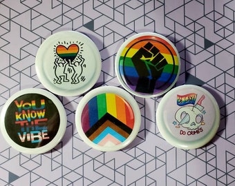 Gay Pride 2.25 Inch Button Badges Set of 5. Great quality waterproof buttons. Includes a free bonus button!!