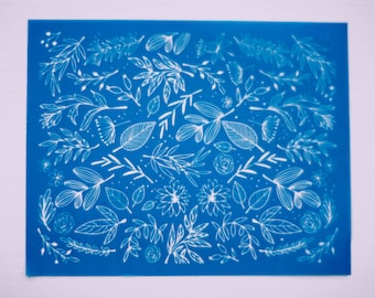 May include: A blue background with a white floral pattern. The pattern includes leaves, flowers, and stems.