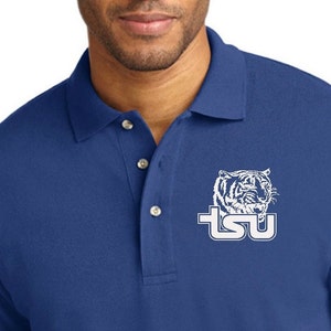 May include: A royal blue long-sleeve polo shirt with a white embroidered tiger and the text "TSU" on the left chest.