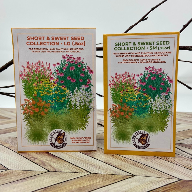 May include: Two seed packets for a short and sweet wildflower collection. The packets are yellow with a white border and feature a colorful illustration of wildflowers. The text on the packets reads "Short & Sweet Seed Collection" and includes the size of the packet in ounces. The packets are on a wooden surface.