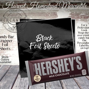 May include: Black foil sheets for wrapping candy bars. The image shows a Hershey's chocolate bar wrapped in black foil with a label that says "Our Personalized Label fits on top!"
