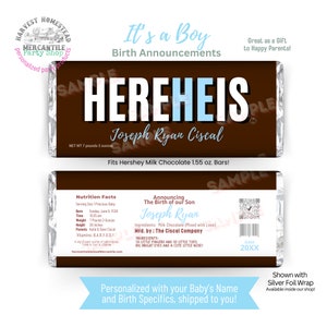 May include: A personalized Hershey's chocolate bar wrapper with the text "HEREHEIS" in white letters on a brown background. The wrapper announces the birth of Joseph Ryan Ciscal. The wrapper is 7 pounds 2 ounces and is a birth announcement.