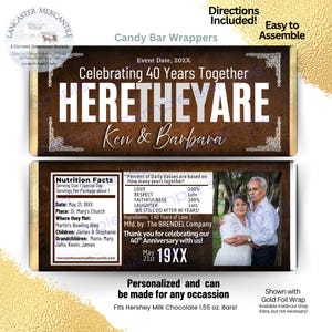 May include: A rectangular candy bar wrapper with a dark brown wood grain background and gold accents. The front features the text Celebrating 40 Years Together, HERETHEYARE, and Ken & Barbara. The back includes a nutrition facts label and a photo.