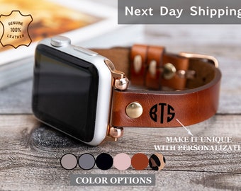 May include: A brown leather Apple Watch band with a gold buckle and a monogrammed initial "GTS". The band is shown on a silver Apple Watch. The image also shows six colour options for the band: light grey, dark grey, black, light pink, brown, and leopard print.