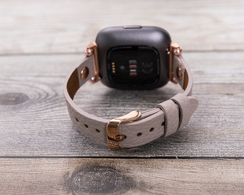 fitbit versa rose gold with white band
