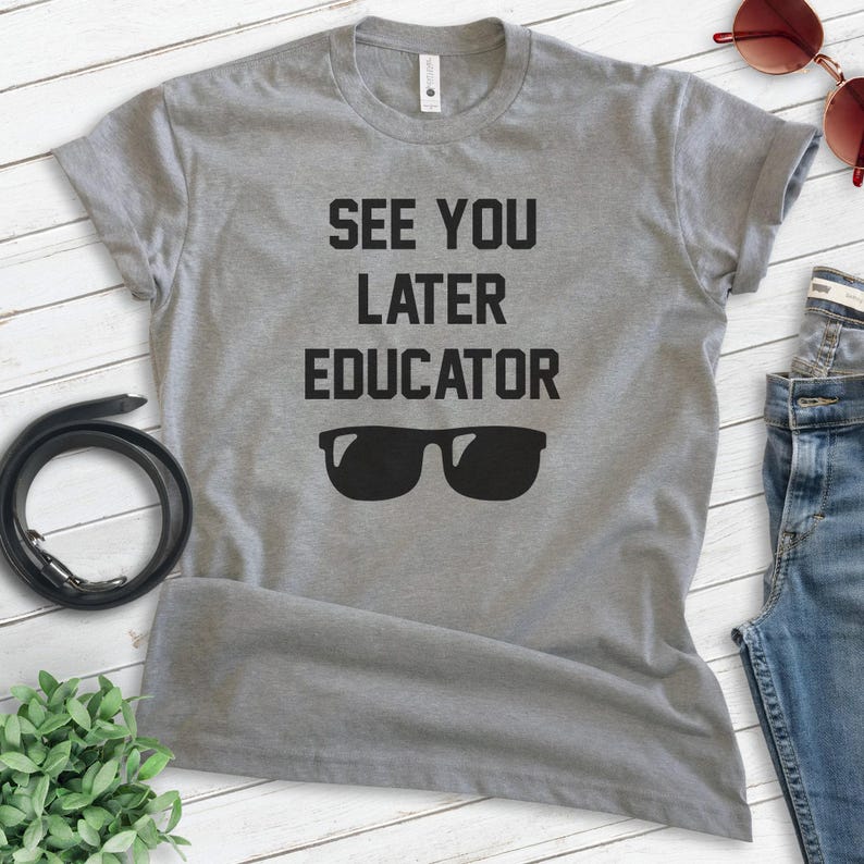 May include: Gray t-shirt with the text "See You Later Educator" and a pair of sunglasses printed on it.