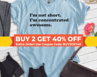 May include: Light blue t-shirt with the text "I'm not short. I'm concentrated awesome."  The shirt has a buy two get 40% off sale with the coupon code BUY2GET40.