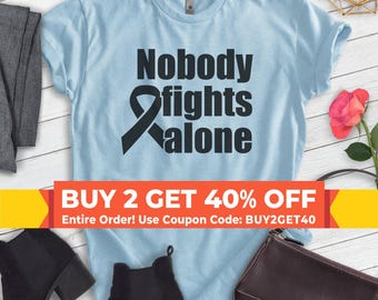 Camiseta "Nadie lucha solo", camiseta unisex, camiseta de apoyo contra el cáncer, camiseta de concienciación sobre el cáncer