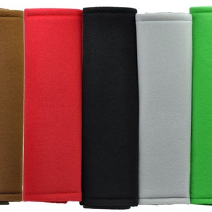 May include: Set of ten seatbelt shoulder pad covers in various colors, including blue, yellow, brown, red, black, gray, green, white, and pink. The pads are made of soft, comfortable fabric and are designed to protect your shoulders from chafing.