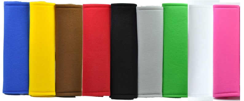 May include: Set of ten seatbelt shoulder pad covers in various colors, including blue, yellow, brown, red, black, gray, green, white, and pink. The pads are made of soft, comfortable fabric and are designed to protect your shoulders from chafing.