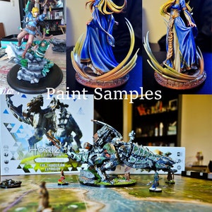 Puede incluir: Se muestran varias figuras pintadas, incluyendo una figura con un vestido azul y pelo rubio, y una figura con arco y flecha. La imagen tambi&eacute;n muestra un modelo de criatura mec&aacute;nica y el texto "Paint Samples".