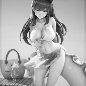 May include: A grayscale figurine of a woman in a white bikini and a flowing skirt, with cat ear headwear. A beach bag, drink, and a float are in the background. The text "ATAGO" is visible on the bag. The figurine is on a wooden table.