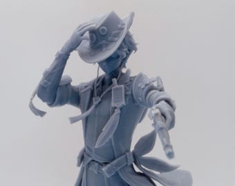 May include: A gray figurine of a character in a cowboy hat, holding a gun. The figure is wearing a long coat, with detailed accessories like straps and pouches. The character is posed with one arm raised, touching the hat.