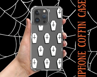 Puede incluir: Una funda de teléfono transparente con un patrón de ataúdes en blanco y negro. La funda está diseñada para un iPhone.