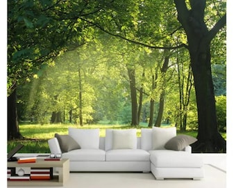 May include: A white sectional sofa with gray throw pillows in front of a green forest mural. The mural depicts a sunny day in a forest with tall trees and green grass.