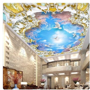 May include: A 3D ceiling mural depicting a blue sky with white clouds and flying doves. The sky is framed by a white and gold ornate ceiling design.