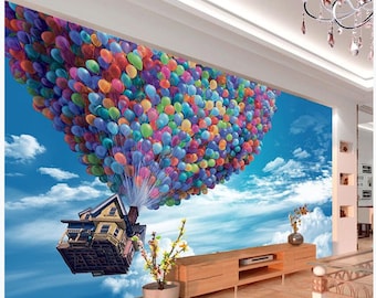 May include: A colorful house with a yellow exterior is lifted into the air by hundreds of multi-colored balloons against a blue sky with white clouds.