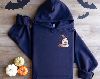 May include: Navy blue hooded sweatshirt featuring a Halloween-themed graphic. The graphic includes a ghost wearing a witch hat, holding a coffee cup, and a jack-o'-lantern. Decorative paper bats are placed around the sweatshirt.