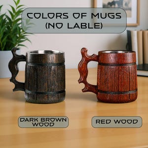 May include: Two wooden mugs with stainless steel interiors. One is dark brown, the other is red wood. Both have decorative handles. The text at the top says "COLORS OF MUGS (NO LABEL)". Below the dark brown mug is the text "DARK BROWN WOOD". Below the red wood mug is the text "RED WOOD".
