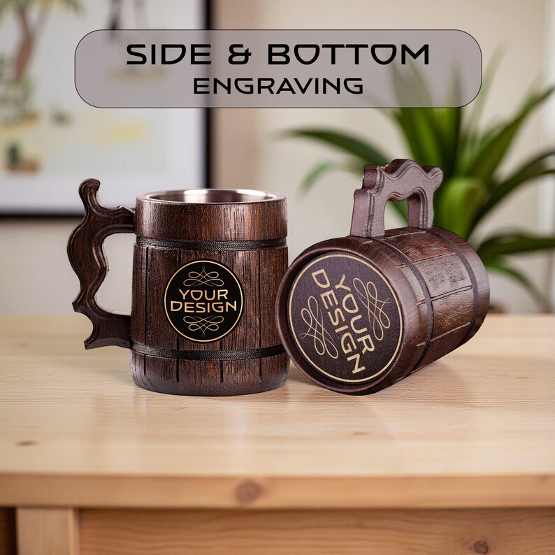 May include: Two wooden beer mugs with a barrel design. One mug is upright, the other is on its side. Both mugs have a handle and a metal interior. The text "YOUR DESIGN" is on the front of each mug. The text "SIDE & BOTTOM ENGRAVING" is at the top.