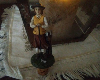 Golfing 1937: Thirties style on the green bottle stopper. Wine cork. Barware accessory. Country club lady. Nostalgic. Golf clubs Yellow vest