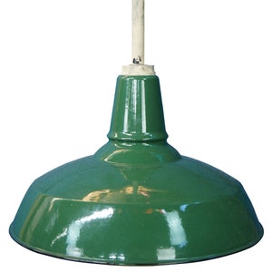 May include: A green, industrial-style pendant light fixture with a glossy finish. The shade is a rounded, bowl shape. It is suspended from a light-colored wooden pole.