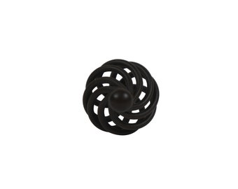May include: Black metal cabinet knob with a circular design featuring a spiral pattern.