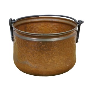 May include: A copper-colored metal cauldron with a hammered texture. The cauldron has a dark metal handle and rim. The interior is visible and appears to be clean. The cauldron is likely used for cooking or decorative purposes.