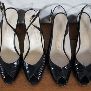 May include: Four black leather peep-toe slingback heels with gold buckles. The heels are all labeled "Bruno Magli" on the inside.