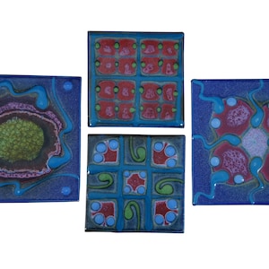May include: Four square ceramic tiles with different abstract designs. The tiles are blue with red, green, and white accents. The designs are geometric and organic.