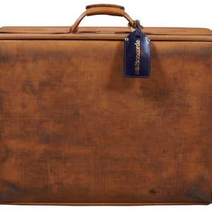 May include: A brown leather suitcase with a worn look and a blue luggage tag that says "British Concorde".