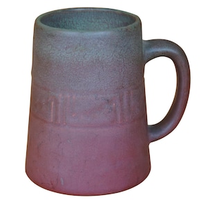 May include: A green and purple ceramic mug with a handle. The mug has a textured surface and a band of raised lines around the middle.