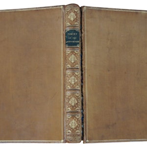 May include: A brown leather-bound book with gold accents and the title "The Poetry of the Anti-Jacobin" on the spine.